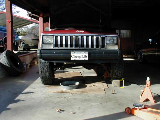 One side of Jeep is lifted. Comparison to other side sitting on 6 x 6" wooden block!